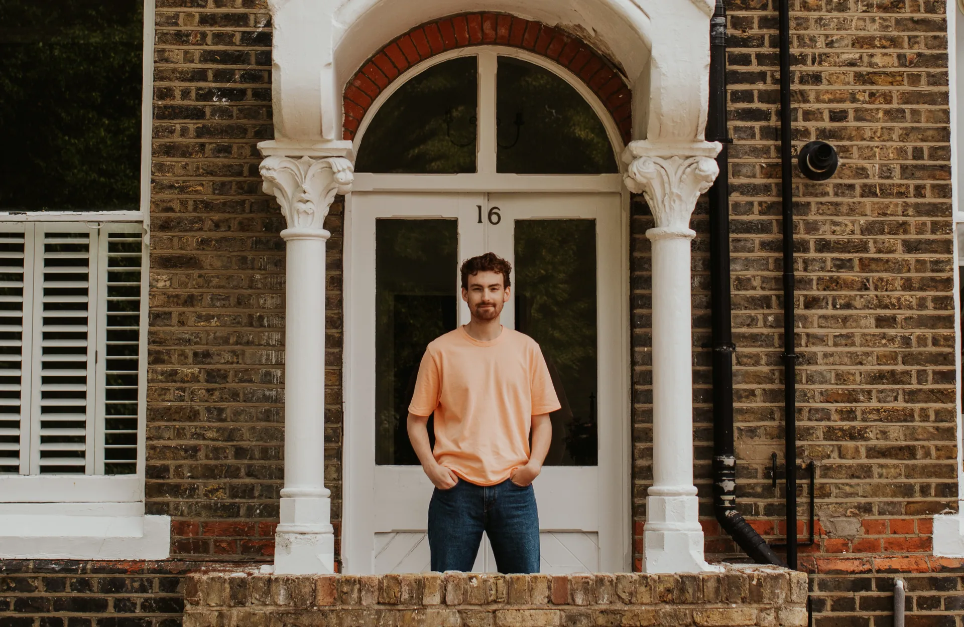 Tom Wicks on his doorstep in London